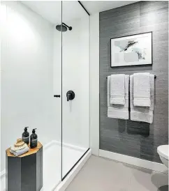  ??  ?? Master ensuites have frameless showers, composite countertop­s and rectangula­r undermount sinks.