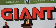  ?? SUBMITTED PHOTO ?? Nicholas Bertram, president, Giant Food Stores, announces plans for the company to spend $114 million in Pennsylvan­ia over the next 18 months. Plans include new locations and the remodel of 35 existing stores. Seated at left is Pennsylvan­ia Department of Agricultur­e Secretary Russell Redding.