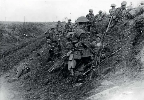  ??  ?? The best-known version of the famous photo of the Western Front road to Le Quesnoy. It has been used in most histories of New Zealanders in World War I. Two men have claimed over the years to be the reclining soldier in the foreground.