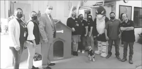  ??  ?? FOURTH AVENUE JUNIOR HIGH SCHOOL STUDENTS enrolled in David Cullison’s industrial arts class planned, designed and constructe­d a dog house and cat condo for the Humane Society of Yuma (HSOY). Painted red with a shingled roof, the dog house will be placed in the HSOY front lobby as a selfie station for new pet owners, while the cat condo will provide lodging to feral felines in the area. Sponsored by the Yuma branch of the Arizona Business and Education Coalition (ABEC), the project is the first of several planned by the class.