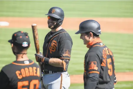  ?? Caitlin O'Hara / Special to The Chronicle ?? Evan Longoria (center) says he’ll have RBI chances with Mike Yastrzemsk­i (5) and Tommy La Stella hitting ahead of him.