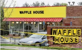  ?? Mark Humphrey / Associated Press ?? Police say a gunman opened fire at a Waffle House in Nashville, Tenn., killing four people and wounding four more before he was stopped by a customer.