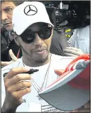  ??  ?? PEN PAL: Hamilton signs for the fans in Mexico City yesterday. He can clinch his fourth title tomorrow