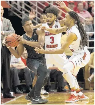  ?? RYAN MICHALESKO/ASSOCIATED PRESS ?? Sophomore guard B.J. Taylor, left, stepped up when UCF needed him most against Illinois State on Monday, and now he and the Knights are one win away from reaching the NIT semifinals at Madison Square Garden.