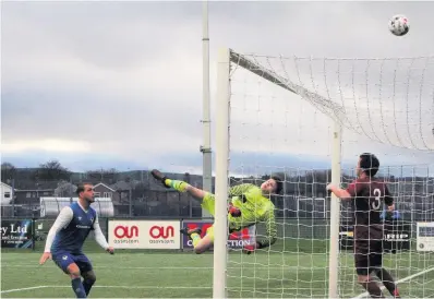  ?? ANDREW LINCOLN ?? Holyhead Hotspur goalkeeper Dan Williams produced this flying save from Asa Hamilton at Airbus last Saturday