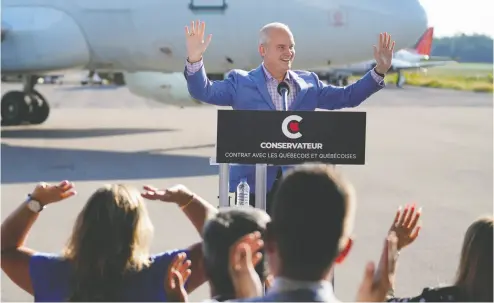  ?? MATHIEU BELANGER / REUTERS ?? Conservati­ve Leader Erin O’toole visits Chrono Aviation on Wednesday on the campaign trail in Quebec City.