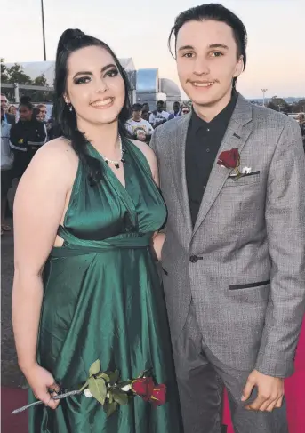  ??  ?? RED CARPET ENTRANCE: Laura Waite and Caleb Presland arrive at the St Saviour's College formal. Photos: Tom Gillespie