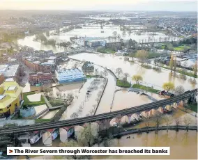  ??  ?? The River Severn through Worcester has breached its banks