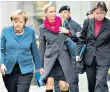  ??  ?? Merkel and Christians­en with Beate Baumann, her chief of staff since 1995