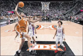  ?? Charlie Riedel
The Associated Press ?? Texas forward Dylan Disu soars to the basket in the first half of the Longhorns’ 76-56 win over Kansas on Saturday at T-mobile Center.