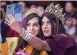  ?? — PTI ?? Members of the LGBTQ click selfies at a conference of their community in New Delhi on Saturday.