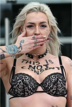  ?? PHOTO: LAURA HUTTON/ COLLINS ?? Anger: Stacie Ellen Murphy protests outside the Courts of Criminal Justice complex in Dublin yesterday.