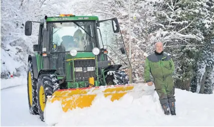  ??  ?? Pushing through Andy Stirrat is happy to help keep the roads clear of snow