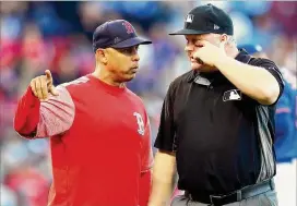  ?? ADAM GLANZMAN / GETTY IMAGES ?? Red Sox manager Alex Cora was the Astros’ bench coach last season when Houston won its first World Series.