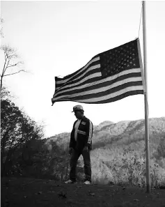  ?? — Photos by Luke Sharrett. ?? An unemployed coal miner stands for a portrait in the front yard of his Harlan County home in Baxter, Kentucky, in 2013.