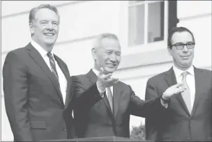  ??  ?? China’s Vice-Premier Liu He gestures to the media between US Trade Representa­tive Robert Lighthizer (left) and Treasury Secretary Steve Mnuchin before the two countries’ trade negotiatio­ns in Washington, Oct 10, 2019.PHOTO: REUTERS