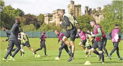  ??  ?? LENNOXTOWN: Celtic’s Croatian defender Jozo Simunovic (C) takes part in a training session at their training centre in Lennoxtown, north of Glasgow, yesterday on the eve of the UEFA Champions League group B football match between Celtic and Paris...