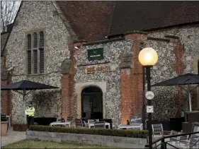  ??  ?? A police community support officer stands inside a cordon outside The Mill pub in Salisbury, England, on Wednesday near to where former Russian double agent Sergei Skripal was found critically ill. Britain’s counterter­rorism police took over an...