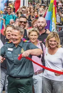  ??  ?? Celebratin­g: Greening (right) at an LGBT Pride Parade