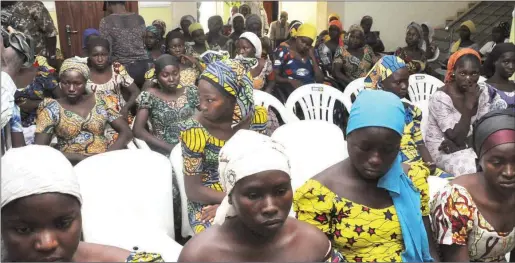  ??  ?? Some of the rescued Chibok girls, at a Government facility, in Abuja....yesterday