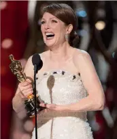  ??  ?? A beaming Julianne after winning her first Best Actress Oscar last year for Still Alice.