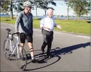  ??  ?? U.S. Rep. Jim Himes walks with First Selectman James Marpe as he prepares to depart Compo Beach Park in Westport.