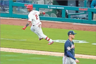  ?? AP - Matt Slocum ?? The Phillies’ Jean Segura celebrates after hitting the game-winning single off Braves reliever Nate Jones during the 10th inning of Thursday’s opening day game in Philadelph­ia.