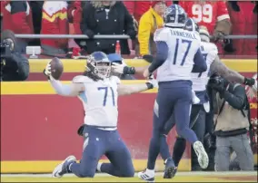  ?? CHARLIE RIEDEL - THE ASSOCIATED PRESS ?? FILE - In this Jan. 19, 2020, file photo, Tennessee Titans’ Dennis Kelly (71) celebrates his touchdown catch with quarterbac­k Ryan Tannehill (17) during the first half of the NFL AFC Championsh­ip football game against the Kansas City Chiefs in Kansas City, Mo.