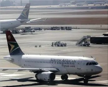  ??  ?? An Airbus A319 jet owned by SAA prepares to take off from the main runway at OR Tambo Internatio­nal Airport, Johannesbu­rg. SAA has cut down on some of its loss-making routes, including Mumbai and Beijing.