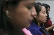  ?? AP PHOTO/SALVADOR MELENDEZ. FILE ?? FILE - Evelyn Beatriz Hernandez sits in court during her second trial, after her 30-year sentence for murder was overturned in February, in Ciudad Delgado on the outskirts of San Salvador, El Salvador, Monday, July 15, 2019. The young woman who was prosecuted under the country’s highly restrictiv­e abortion laws after birthing a baby into a pit latrine says she had no idea she was pregnant, as a result of a rape.