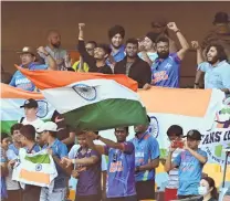  ?? PHOTO: GETTY IMAGES ?? Appreciati­ve crowd . . . Indian fans celebrate victory at The Gabba in the test series between Australia and India last month.