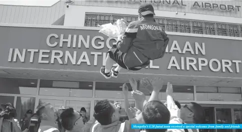  ??  ?? Mongolia’s U20 futsal team received a special welcome from family and friends