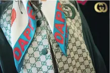  ??  ?? This Gucci-Dapper Dan jacket and scarf are a nod to the designer’s past.