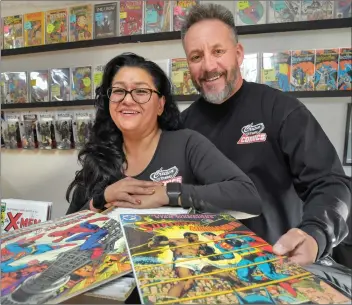  ?? Dan Watson/The Signal ?? Gloria and John Cruz share store responsibi­lities at Cruzin’ Thru Comics in Canyon Country.