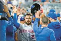  ?? LYNNE SLADKY/AP FILE ?? Needing to make a difficult decision at catcher, the New York Mets cut Nido on Monday when they reinstated fellow backstop Omar Narváez, center from the 60-day injured list.