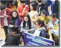  ??  ?? XINHUA Job seekers speak with recruiters at Hefei University in Hefei, Anhui Province, China, at a job fair for college graduates.