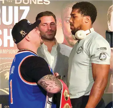  ??  ?? Eyeball to eyeball World champion Andy Ruiz, left, and challenger Anthony Joshua face off at Wednesday’s press conference ahead of their Clash On The Dunes heavyweigh­t title clash on Saturday at Diriyah Arena near Riyadh.