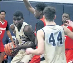  ?? BERND FRANKE/ REGIONAL SPORTS EDITOR ?? Notre Dame's Shamar Campbell, with the ball, drives to the hoop in Ontario Catholic Basketball Tournament action against Mississaug­a St. Marcellinu­s Friday in Welland. Notre Dame had the deepest run of the four teams from Niagara finishing 1- 2.