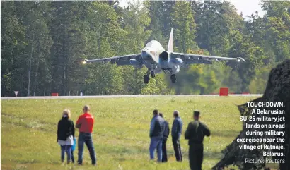  ?? Picture: Reuters ?? TOUCHDOWN. A Belarusian SU-25 military jet lands on a road during military exercises near the village of Ratnaje, Belarus.