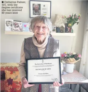  ??  ?? Catherine Palmer, 101, with the degree certificat­e she has received 80 years later