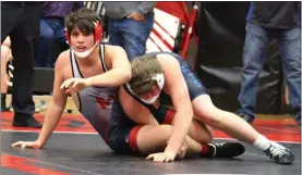  ?? Alex Eller ?? Sebastion Younes of Anselmo-Merna wrestles his opponent from North Central during the Anselmo-Merna Invite. He ended up going 1-2 at 182 pounds for the Coyotes at the meet.