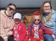  ??  ?? Rachel Walls, left, and her daughter Kamaryn, 5, and Erin Colby, and her daughter, Cassidy, 4, as the kids wait for their turn at an egg hunt.