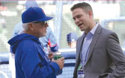  ?? | AP ?? Joe Maddon, talking to Theo Epstein, says he doesn’t want to damage the confidence of his struggling players.