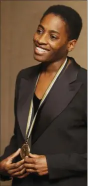  ?? MARK LENNIHAN — THE ASSOCIATED PRESS FILE ?? In this file photo, Jacqueline Woodson, a nominee for the National Book Award for young people’s literature, poses for photograph­ers before the ceremony in New York. Woodson has been named the country’s new National Ambassador for Young People’s...