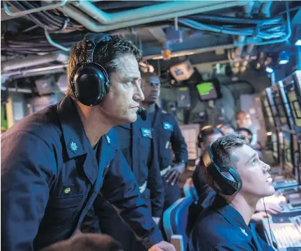  ?? VVS FILMS ?? Scottish actor Gerard Butler, left, stars as Capt. Joe Glass, leader of the U.S.S. Arkansas, in the mostly manly movie Hunter Killer.