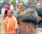  ?? HT ?? CM Yogi Adityanath along with priests taking part in Akhand Jyoti Yatra that was taken out at Gorakhnath temple on Sunday.