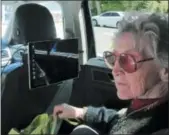  ?? THE ASSOCIATED PRESS ?? Sharon Van Etten listens to a computeriz­ed voice in a vehicle equipped with software meant to help the visually impaired interact with self-driving cars in Ocala, Fla.