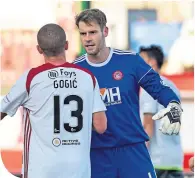  ??  ?? Williams chats to Alex Gogic at full-time