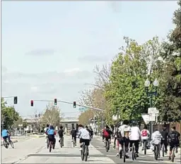  ?? CONTRIBUTE­D PHOTO ?? This photo taken in April shows several young bicyclists blocking the northbound lanes of Chester Avenue as traffic behind them waits for them to clear the roadway. “It’s getting bad,” said Koral Hancharick, who witnessed it. “They are not following traffic laws,” she said, “and (they show a) total lack of respect.” But her biggest concern, she said, is that someone is going to get hurt.