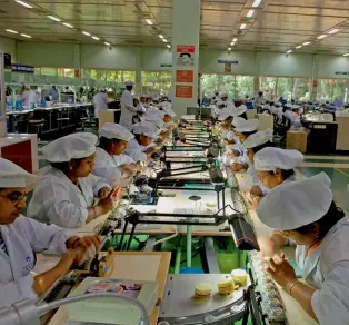  ?? HEMANT MISHRA/GETTY IMAGES ?? LIKE CLOCKWORK Titan’s watch factory at Hosur